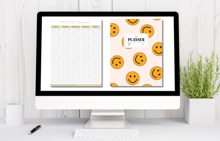Editable monthly SLP planner page and playful smiley cover displayed on desktop computer
